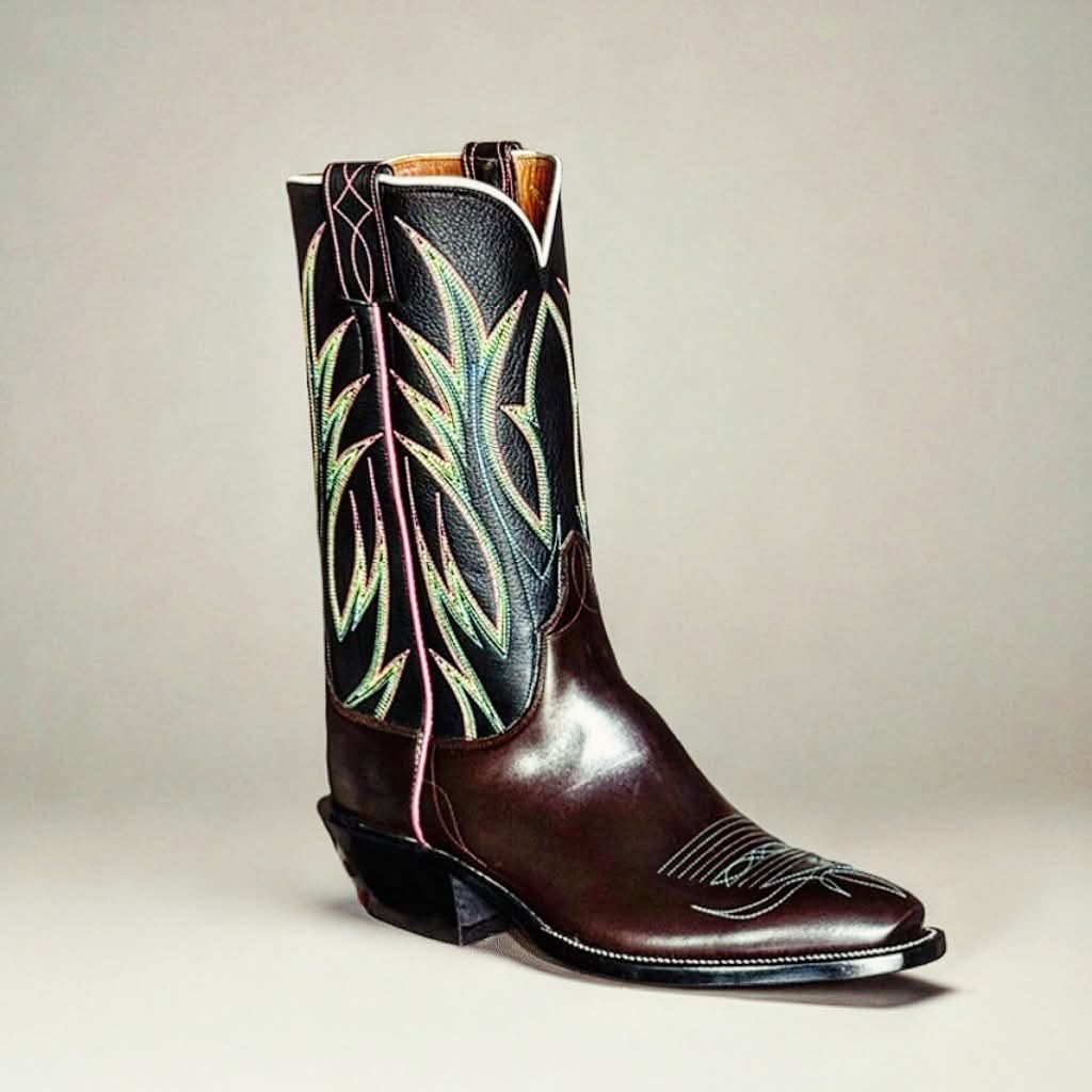 Short black boot tops with pink and green stitching over a dark brown vamp with a toe medallion
